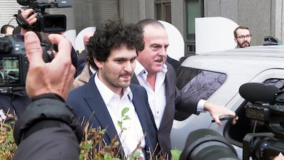 Sam Bankman-Fried leaves a Manhattan federal court on bail. He is accused of swindling FTX investors and looting customer deposits. AP