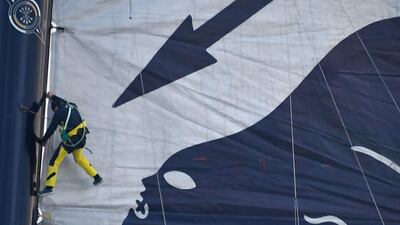 A sailor works on the mast of Gitana 17, skippered by Franck Cammas and Charles Caudrelier, on Tuesday, November 5, in France before the start of the Brest Atlantiques race that loops around the Atlantic ocean and covers more than 22,500km. AFP