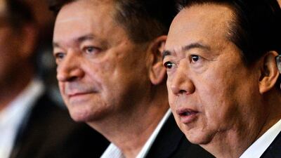 Interpol vice president Alexander Prokopchuk (L) and and Meng Hongwei, president of Interpol, attend the opening of the Interpol World Congress in Singapore on July 4, 2017. / AFP / ROSLAN RAHMAN