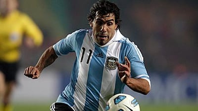 Carlos Tevez, pictured here playing for Argentina in their Copa America draw with Bolivia at the weekend, cites family reasons for wanting away from Manchester City.