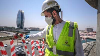 Saif Abdul Hay from the Abu Dhabi City Municipality inspects safety standards of a construction site in Al Raha Gardens. Victor Besa / The National