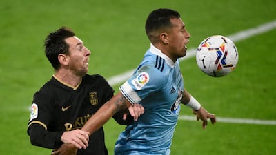 Barcelona forward Lionel Messi vies with Celta Vigo's Jeison Murillo. AFP