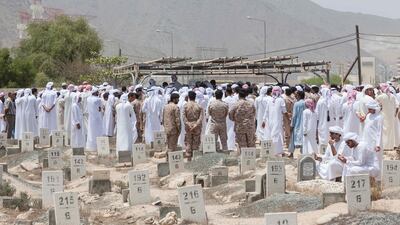 Family and commmunity members gather at the cemetery in Qidfa, Fujairah to lay Abdullah Hayayei to rest. All photos by Antonie Robertson /The National