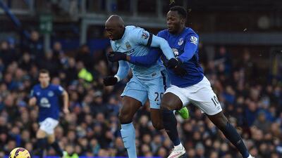 Manchester City's Eliaquim Mangala, left, vies with Everton's Romelu Lukaku during their Premier League match at Goodison Park on Saturday. Paul Ellis / AFP / January 10, 2015