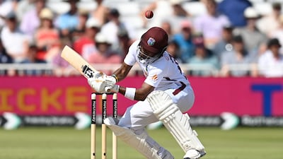 West Indies batter Kavem Hodge ducks out of the way from a short ball from England's Mark Wood. Getty Images