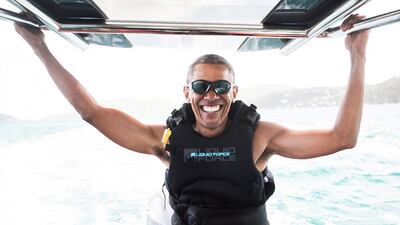 Former US president Barack Obama sits on a boat during a kite surfing outing with British businessman Richard Branson during his holiday on Branson’s Moskito island, in the British Virgin Islands. Jack Brockway/Virgin Handout via Reuters