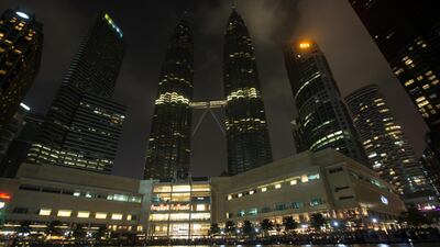 Malaysia's landmark Petronas Twin Towers and surroundings with lights turned off to mark Earth Hour in Kuala Lumpur. EPA