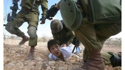 A Palestinian youth is arrested by Israeli soldiers for throwing stones during a protest in Karmi Tsour in October last year. The Middle East's most intractable conflict is poised for another year of acrimony, petty squabbles and irresolution.