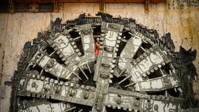 Engineers wave through gaps in the drill face after a boring machine broke through to complete HS2's longest tunnel, in Great Missenden, England. The high-speed rail line will run between London and Birmingham. Getty Images