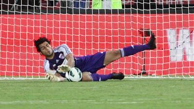 Al Ain goalkeeper Dawoud Sulaiman stops an Al Jazira penalty as he inspires his side to Super Cup victory