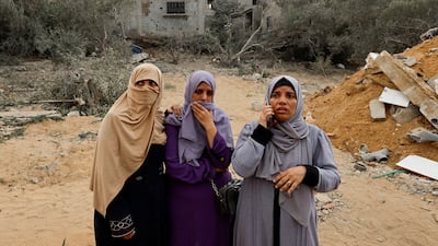 Palestinian women at the site of an Israeli strike in Khan Younis in the southern Gaza Strip. Reuters