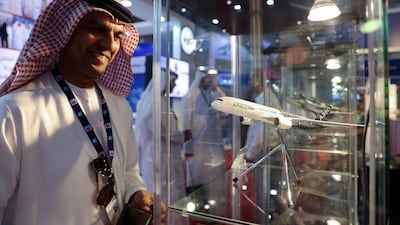 Jasim Hassan looks at a model of an Airbus A350 at the Dubai Airshow on Tuesday, November 14, 2017. Chris Whiteoak / The National