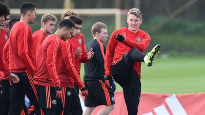 Manchester United's German midfielder Bastian Schweinsteiger, right, takes part in a training session their Carrington facility in Manchester. AFP PHOTO / PAUL ELLIS