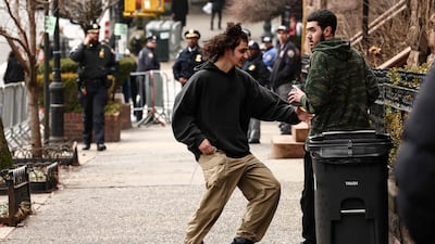 An activist is handed a homemade explosive during a protest in New York City. All photos: AFP