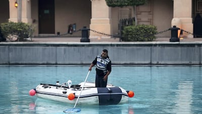 Dubai, United Arab Emirates - January 01, 2011: The clean up operations after the celebrations the night for New Years Eve 2019. Tuesday, December 1st, 2019 in Downtown, Dubai. Chris Whiteoak/The National