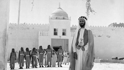 Sheikh Shakhbut bin Sultan Al Nahyan, Ruler of Abu Dhabi, stands in front of Qasr Al Hosn. Courtesy National Archives