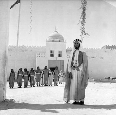 Sheikh Shakhbut bin Sultan, Ruler of Abu Dhabi, stands in front of Qasr Al Hosn. Courtesy National Archives