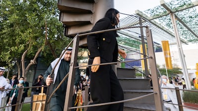 Nathalie Kennedy, France's consul-general in Dubai, leads the way up the steps of the Eiffel Tower at Al Forsan Park, Expo 2020 Dubai. Photo: Anthony Fleyhan / Expo 2020 Dubai