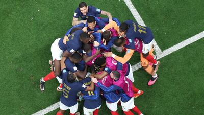 France forward Randal Kolo Muani celebrates with teammates after scoring their second goal. AFP