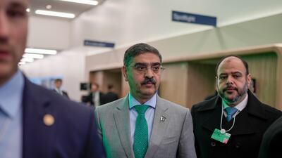 Pakistan's caretaker prime minister Anwar ul-Haq, centre, after his speech at the annual meeting of the World Economic Forum in Davos, Switzerland. AP