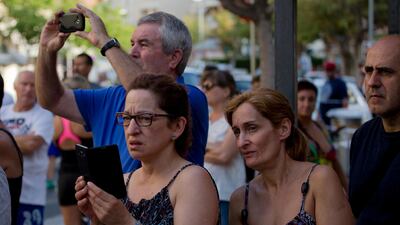 Bystanders in Cambrils look at the scene of the terror attack. Emilio Morenatti / AP Photo