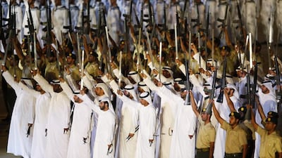 Members of the Armed Forces parade during celebrations at the Zayed Sports Stadium. EPA /Ali Haider