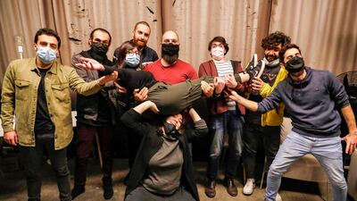 (L-R back row) Stand-up comedians Mario Moubarak, Firas Shamieh, Mohammed Baalbaki, Nicolas Tawk, Iyad Al-Hout, Georges, and Georges pose for a picture behind Shaden (on her knees) and Lama Chmayaa (carried), before taking part in a comedy night organised by the "Awk.word" platform ahead of their show at the KED Beirut venue in the Lebanese capital's Karantina neighbourhood. In a venue wedged between two districts ravaged by the deadly August 4 explosion at Beirut's port, laughter abounds despite an acute economic crisis compounded by a coronavirus pandemic and the port blast. AFP
