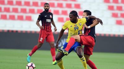 Al Dhafra captain Makhete Diop, left, led by example to score three goals in the 3-3 draw with Al Ahli. Courtesy Arabian Gulf League