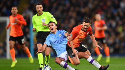 Manchester City's Spanish midfielder Rodri and Shakhtar Donetsk's Ukrainian forward Junior Moraes. AFP
