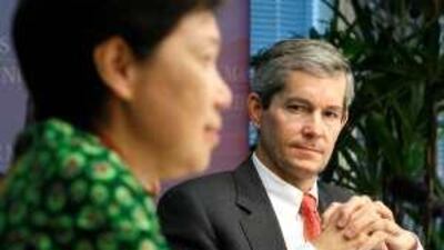 Chip Goodyear, right, and Ho Ching, the chief executive of Temasek. Mr Goodyear had been earmarked for the top role at Temasek.
