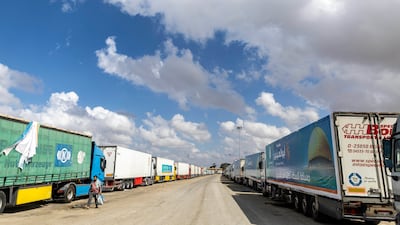 Lorries carrying aid queue at the Rafah crossing as they wait for clearance to enter Gaza on Thursday. Getty Images