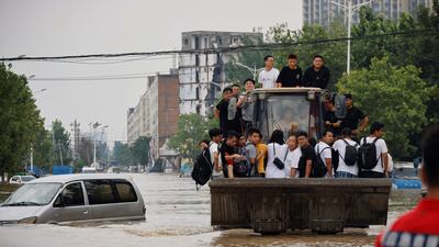 The death toll includes at least 12 people who were killed when water flooded underground train carriages in Zhengzhou.