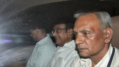 India's former finance minister Palaniappan Chidambaram, centre, is taken away by Central Bureau of Investigation officials after being arrested at his residence in New Delhi on August 21, 2019. Reuters