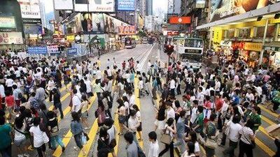 Shoppers pack the street in Hong Kong. The UAE is expected to gain visitors from Hong Kong and China following the opening of direct flights.