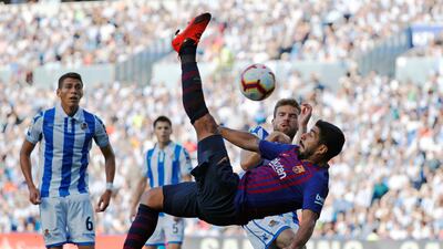 Barcelona's Luis Suarez with an acrobatic shot at goal. Reuters