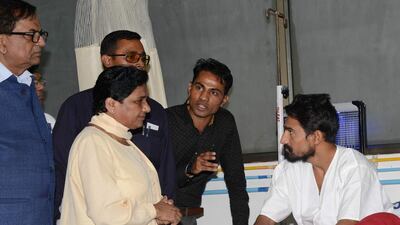 The chief of the Bahujan Samaj Party, Mayawati (second from left) visits Vashrambhai Sarvaiya (right), one of four Dalit youths who were badly beaten by cow protectors in the Una region of Gujarat, at the Civil hospital in Ahmedabad on August 4, 2016. Sam Panthaky/AFP