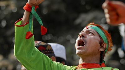 A Bangladeshi man shouts slogans against a nationwide strike called by the Jamaat-e-Islami party in Dhaka, Bangladesh. AM Ahad / AP Photo