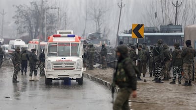 Indian security officers stand guard near the site blast in Lethpora area of south Kashmir' s Pulwama district some 20 kilometers from Srinagar, the summer capital of Indian Kashmir. EPA
