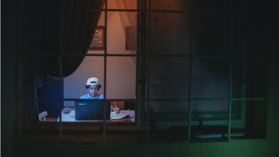 A young Saudi boy performs his studies at home due to the pandemic. Photo by Hussain Ali A Buhligah