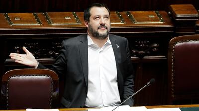 Deputy Premier Matteo Salvini looks up as he answers questions at parliament in Rome. The Italian economy shrank for two consecutive quarters at the end of last year increasing the pressure on Italian government. AP