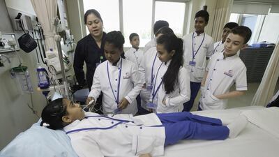 Pupils in Al Sharq Hospital’s Nurse of the Future programme learn how to take patients’ vital signs. The programme, in its second year, is hoping to attract a new generation of nurses, particularly Emiratis. Jaime Puebla / The National