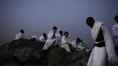 Muslim pilgrims pray on the Mountain of Mercy, on the Plain of Arafat. Nariman El-Mofty / AP Photo