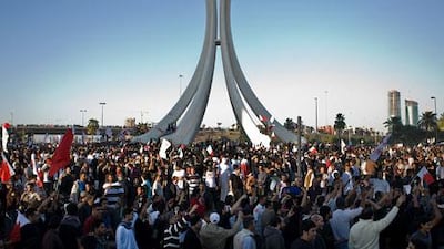 Protesters celebrate their return to the Pearl Roundabout in Manama, Bahrain.