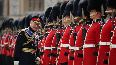 King Charles III, Colonel-in-Chief of the Coldstream Guards, inspects the regiment at Windsor Castle before the Trooping the Colour military parade, in central London, marking his official birthday. AFP