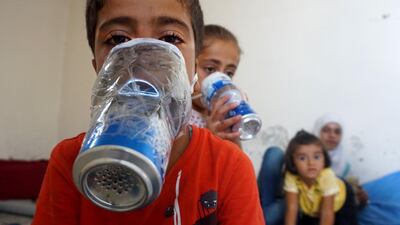 A child wears an improvised gas masks in Syria's rebel-held northern Idlib province. AFP