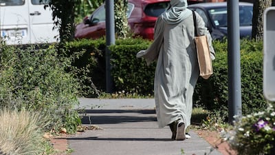 A woman in Lille, northern France, on August 28, 2023. A US commission says banning girls from wearing the garment to school is misguided. AFP