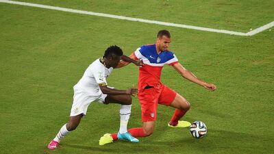 John Brooks of the USA, shields the ball from Ghana striker Asamoah Gyan. Laurence Griffiths / Getty Images