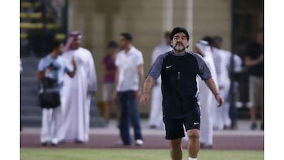 Al Wasl's head coach Diego Maradona appears on the pitch earlier this week. A reader cautions that people should be realistic about Maradona's performance instead of being enamoured by his fame. Mike Young / The National
