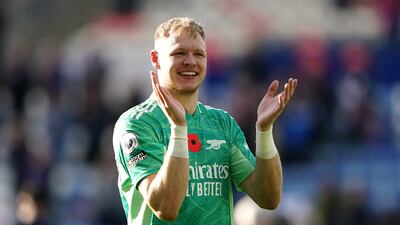 Arsenal goalkeeper Aaron Ramsdale salutes the fans. PA