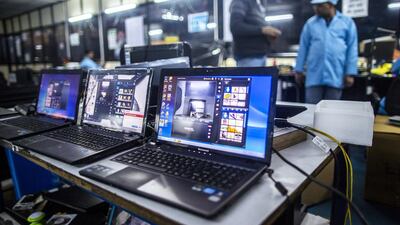 Lenovo laptop computers await testing in the electronics section. Prashanth Vishwanathan / Bloomberg